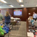 Merrill Lynch assembling Home Kits that provide basic household items that aid in the transition to independent living for those who have experienced homelessness.